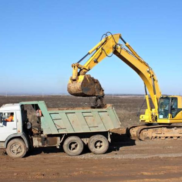 Dredge and dump-body truck Ace Excavating Austin - Land Clearing, Grading & Site Prep